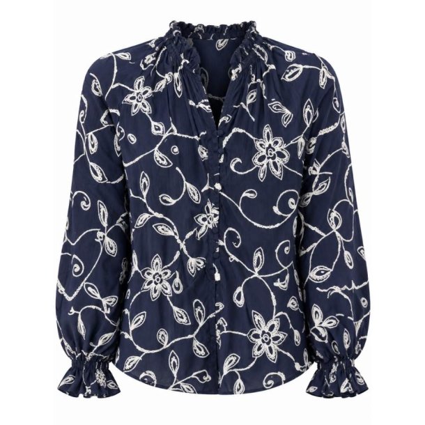 In April 1986 m�rkebl� bluse med lyst blomsterm�nster Q3171