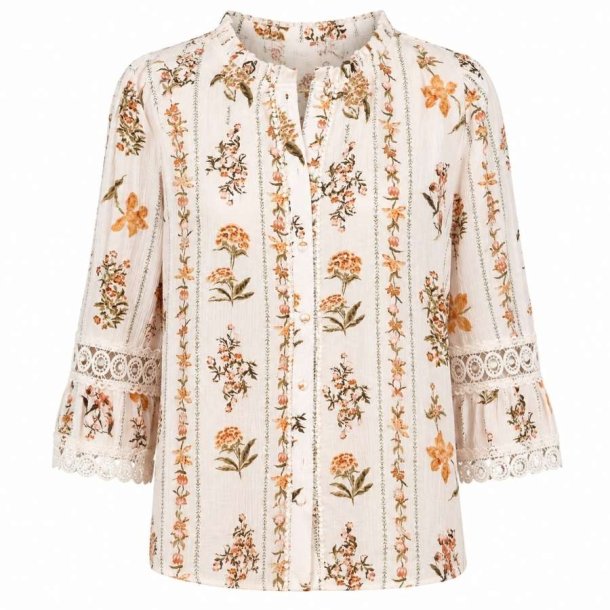 In April 1986 creme skjorte med blomsterprint og blondedetaljer